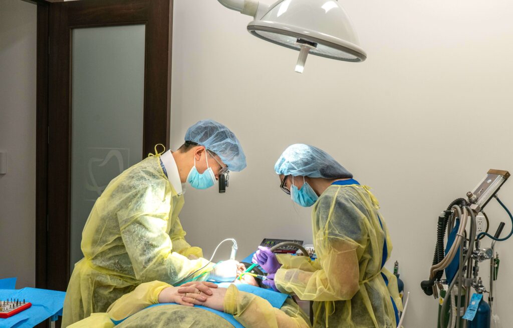 Emergency dental clinic staff operating in yellow uniforms